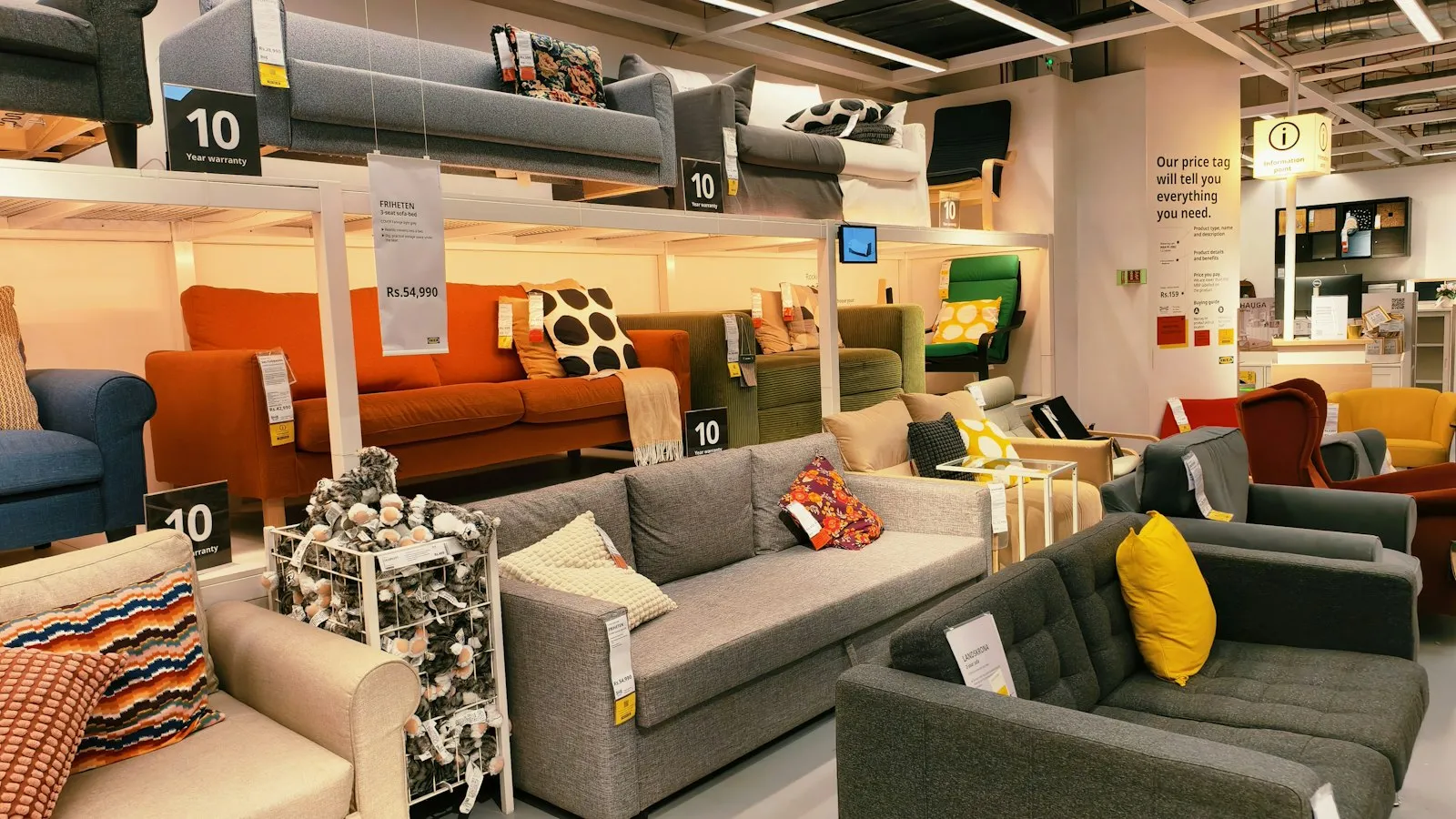 Armchairs and sofas on display in a furniture showroom