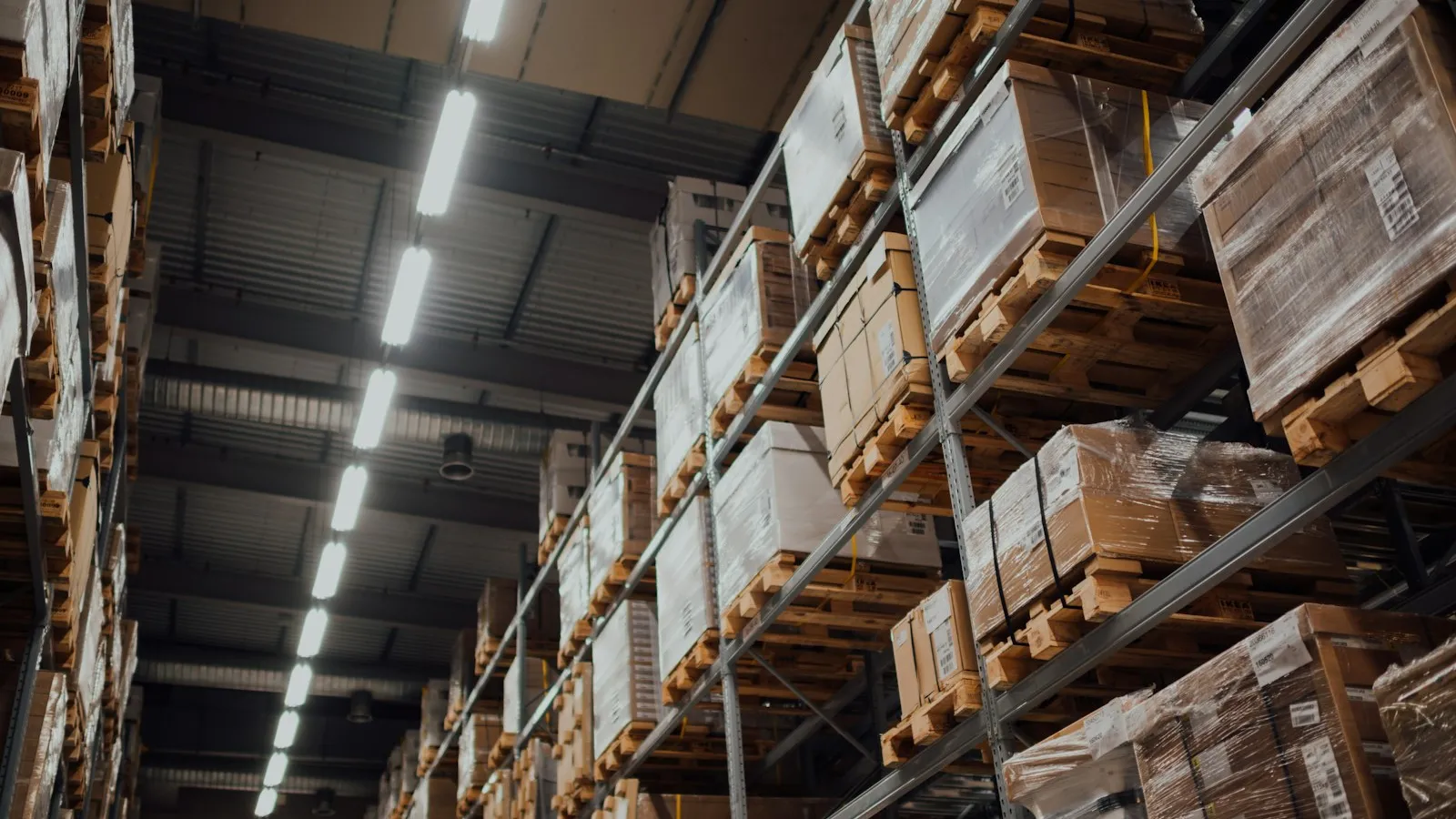 Cardboard boxes on white metal shelves